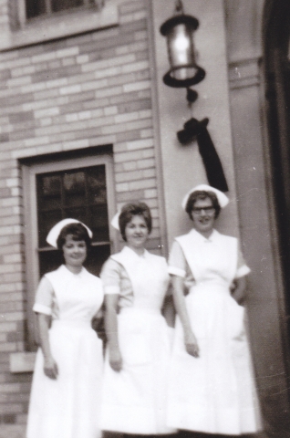 Pam Stephani, Karen Swanson, Eileen Stromer outside dorm side entrance 